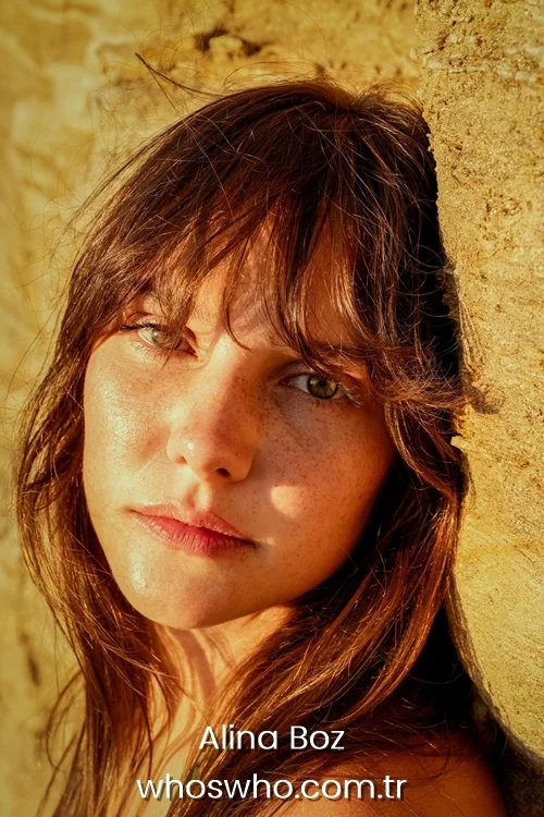 Close-up portrait of Turkish actress Alina Boz in warm natural sunlight.