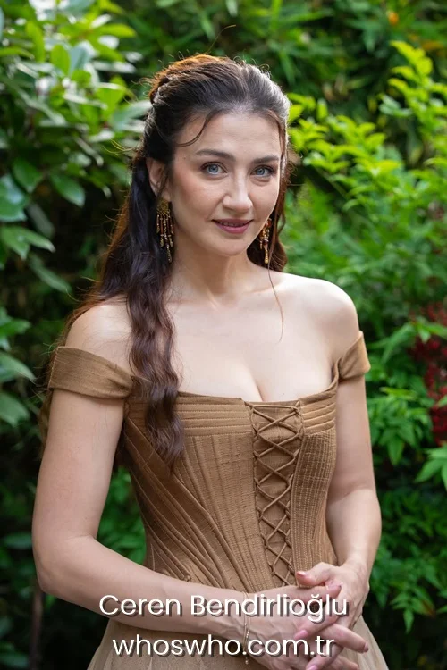 Ceren Benderlioglu in a brown off-shoulder lace-up corset dress.