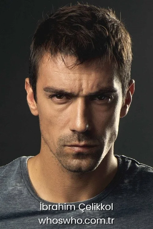 Close-up headshot of Turkish actor Ibrahim Celikkol with a serious expression and short hair, wearing a grey t-shirt against a dark background.