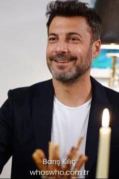 Barış Kılıç height Baris Kilic smiling while wearing a black blazer jacket and white t-shirt.