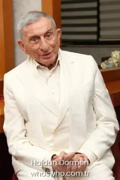 Official biography cover portrait of legendary Turkish actor and theater director Haldun Dormen smiling in a white suit.
