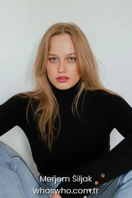 Actress Merjem Šiljak with blonde hair wearing a black turtleneck sweater and denim jeans.