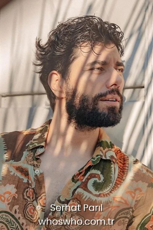 Serhat Parıl posing outdoors in a patterned shirt during a casual portrait session.