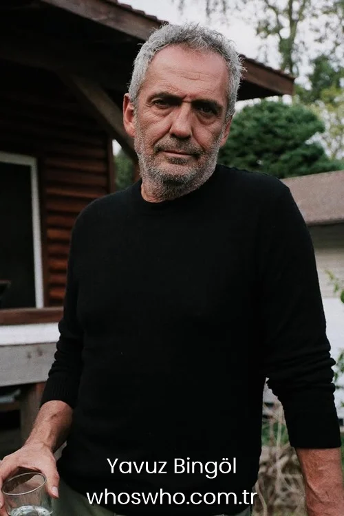 Yavuz Bingol in a black long-sleeve sweater standing outdoors.