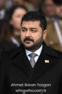 Turkish politician Ahmet Baran Yazgan portrait in a black coat and tie for his official biography profile cover.