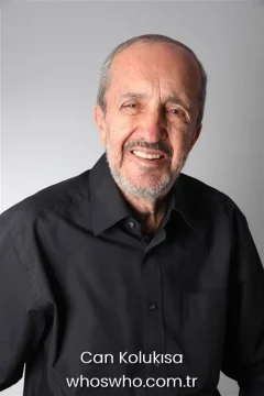 Turkish actor Can Kolukisa wearing a black button-down shirt, official biography cover photo