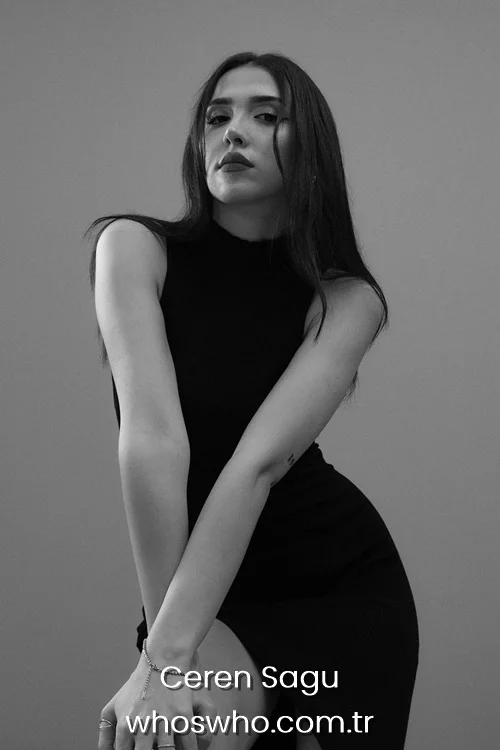 Turkish pop singer Ceren Sagu posing in an elegant sleeveless high-neck black dress for a monochrome studio portrait 