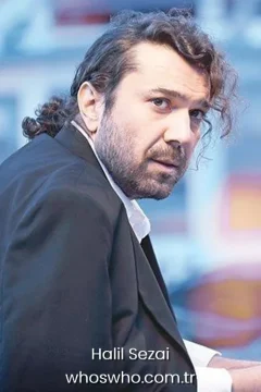 Halil Sezai biography Turkish singer and actor Halil Sezai portrait in a black blazer jacket for his official biography profile cover.