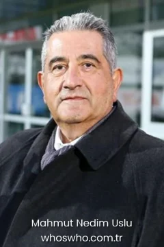 Turkish sports executive Mahmut Nedim Uslu posing in a black coat for his official biography profile cover.
