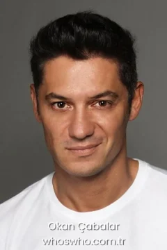 Turkish actor and comedian Okan Cabalar wearing a white t-shirt, official biography cover photo