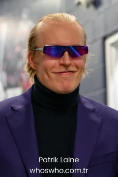 Patrik Laine height Ice hockey player Patrik Laine portrait in a purple suit and futuristic sunglasses for his official biography profile cover.