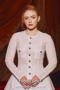 Actress Sadie Sink portrait in an elegant white buttoned dress for her official biography profile cover.